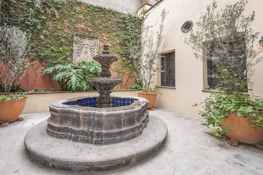 El Obraje main floor, first courtyard with fountain and main bedroom