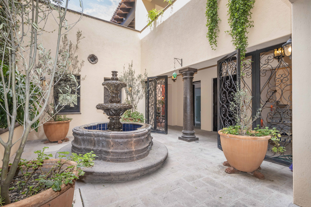 El Obraje main floor, first courtyard with fountain and main bedroom